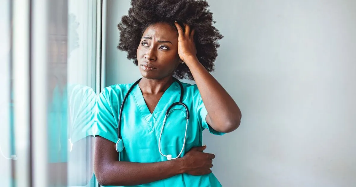 A service worker looking stressed out