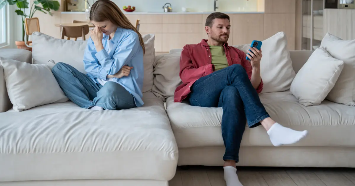 a couple sitting on the couch in a manipulative game