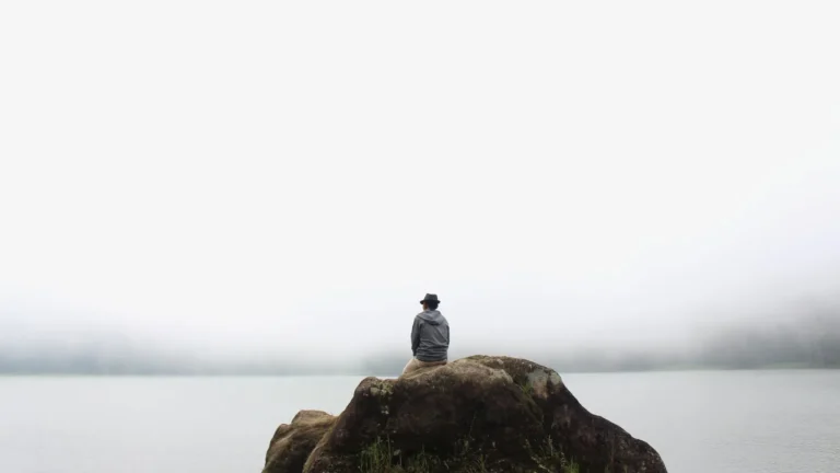 A man by the ocean learning how to stop identifying with your thoughts