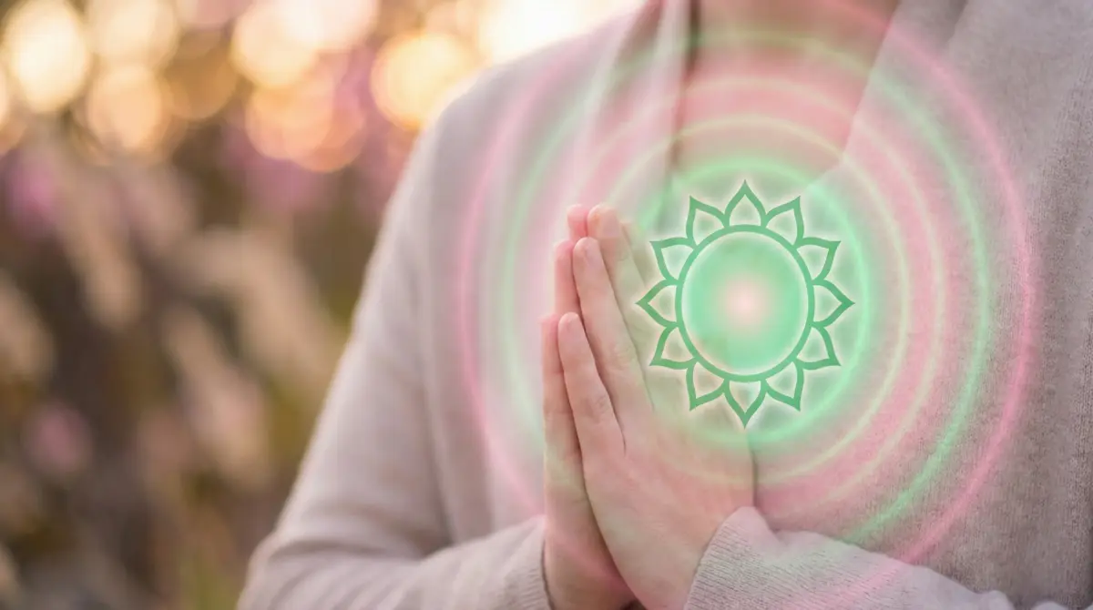 Heart chakra Anahata energy center with green healing light for emotional boundaries