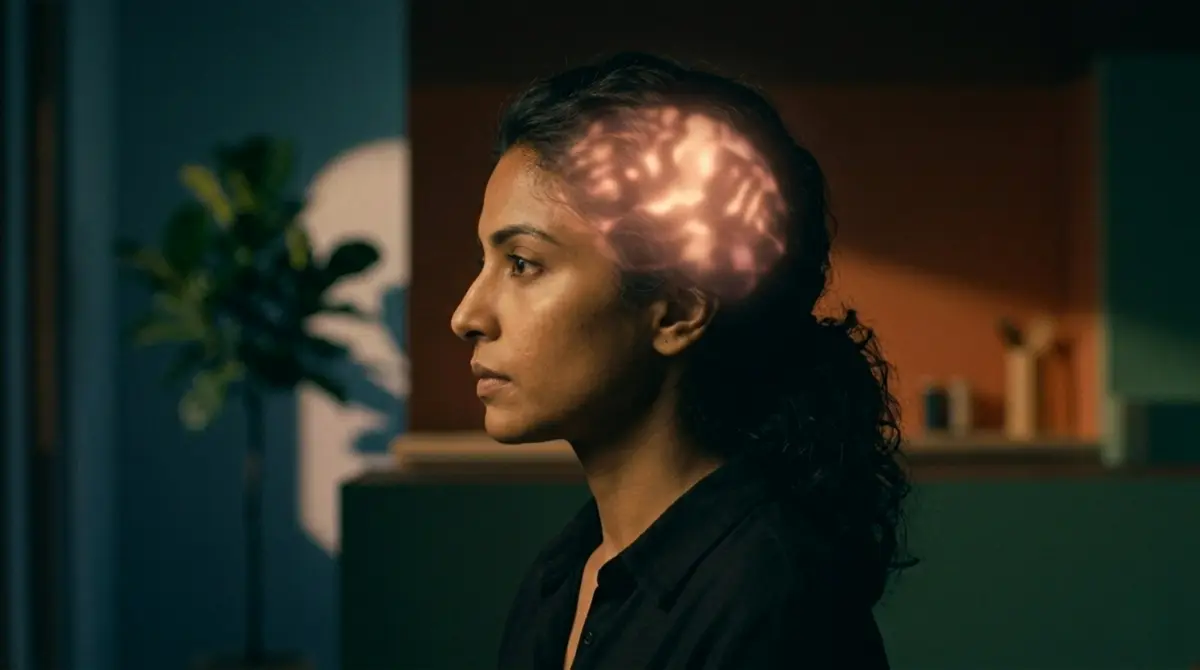 Woman in profile with a glowing, brain-like pattern on her head